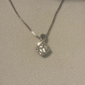 White gold 16” box chain, white zircon surrounded by .16 carot diamonds